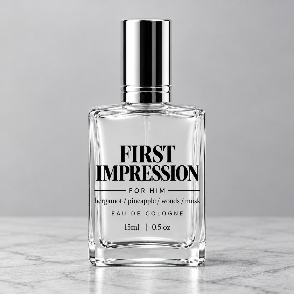 A clear glass bottle of First Impression Eau de Cologne with a shiny silver cap, featuring dark purple text on the front, set against a neutral gray background.